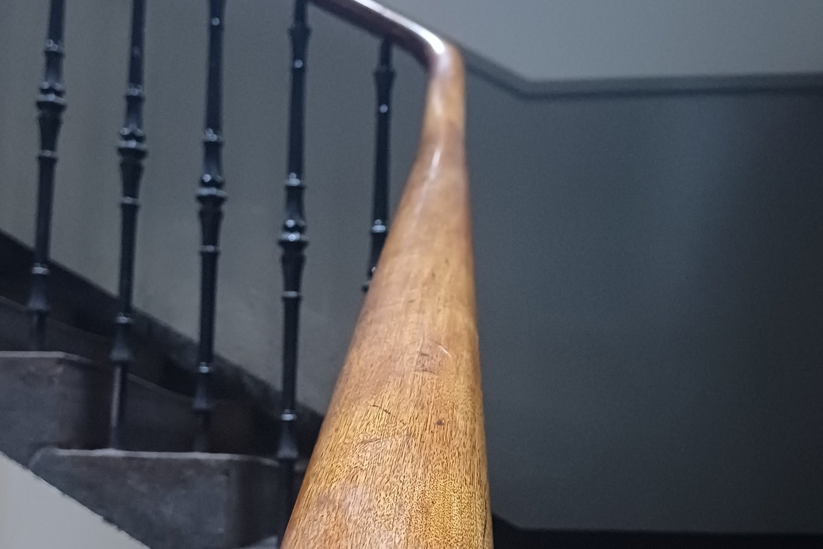 Handrail in shared building stairwell